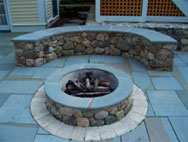 Outdoor fire pit, patio, and stone wall